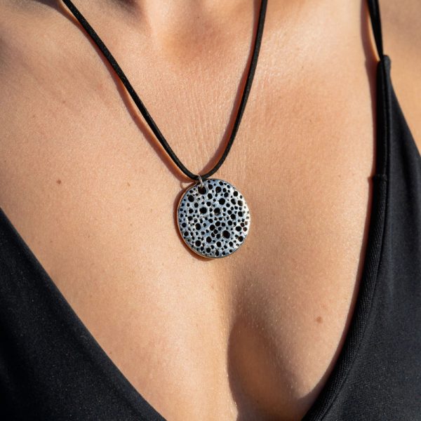 Unique Shelly's Drift Pendant on beautiful beach girl