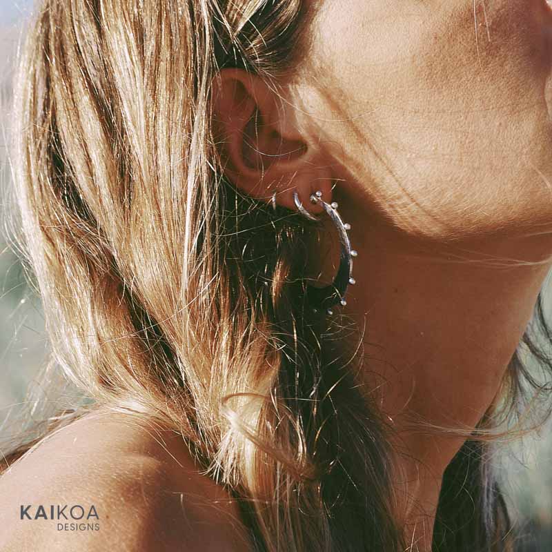 blonde girl wearing ocean beach inspired silver hoop sterling silver earring