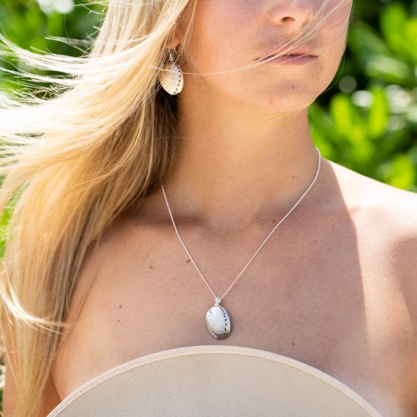 Beautiful blonde girl wearing Paua Shell sterling silver set