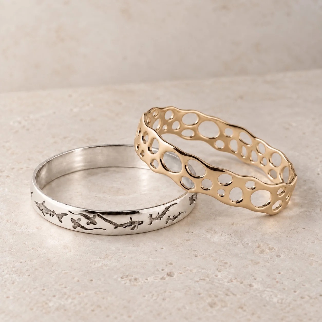 Shark bangles in solid gold and sterling silver
