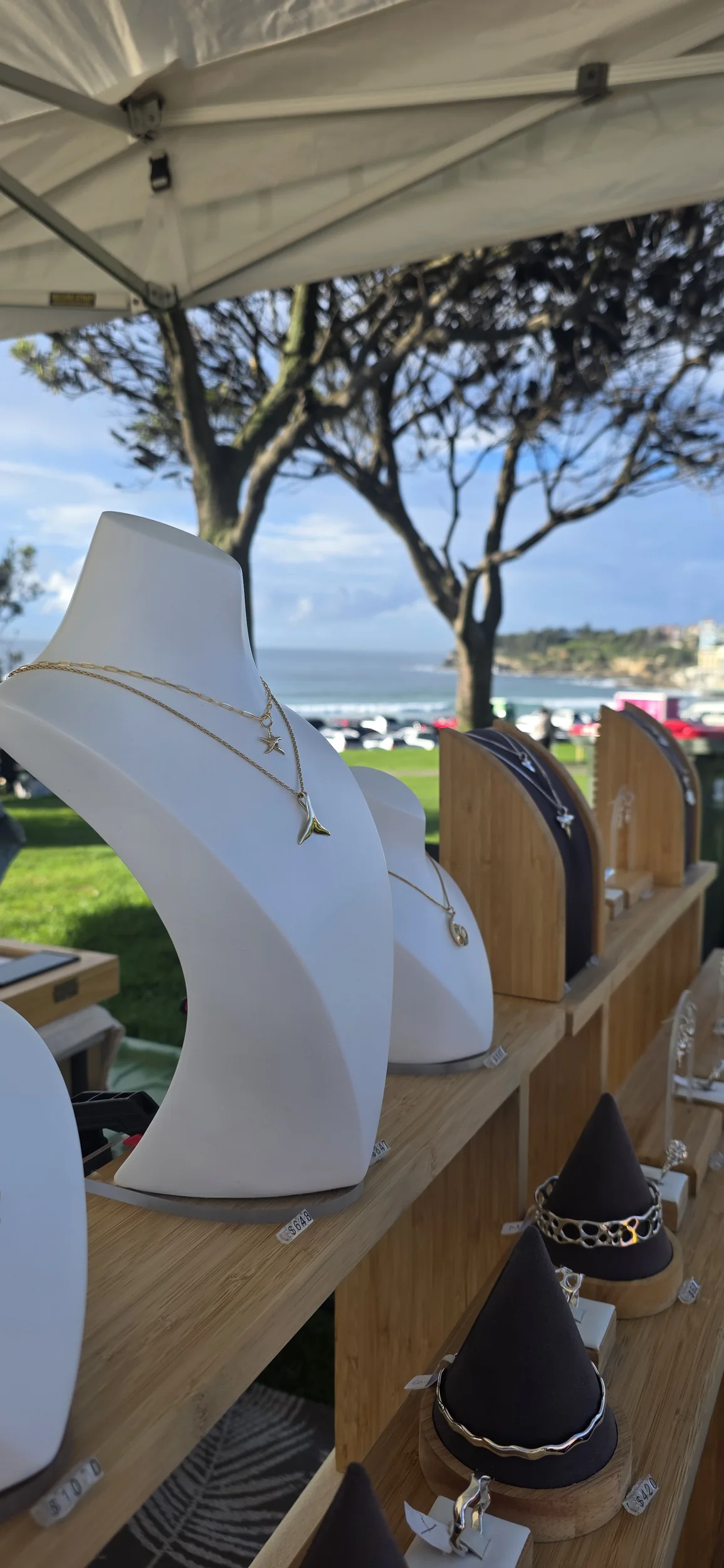 Kaikoa jewellery displayed at a coastal market
