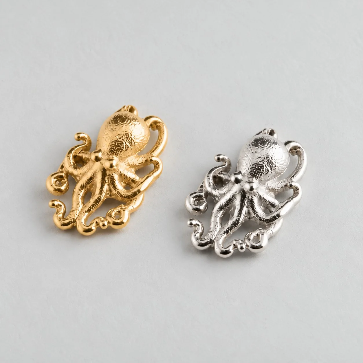 Medium Octopus pendants in solid gold and sterling silver