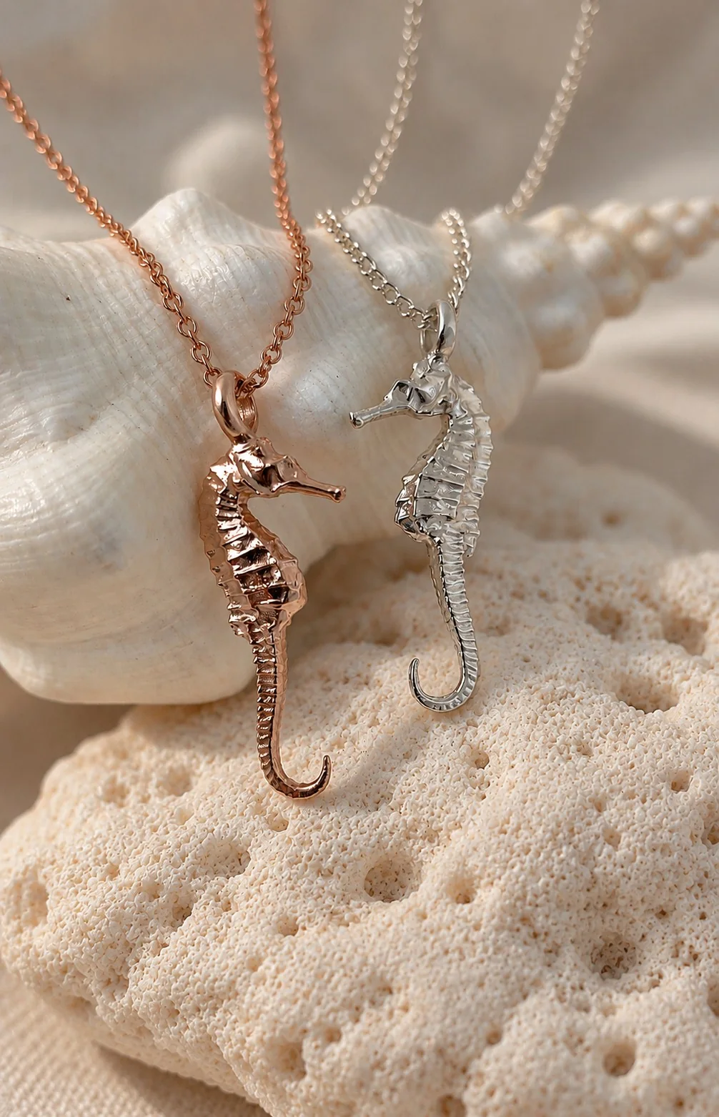 Free diver and whale shark pendants worn together