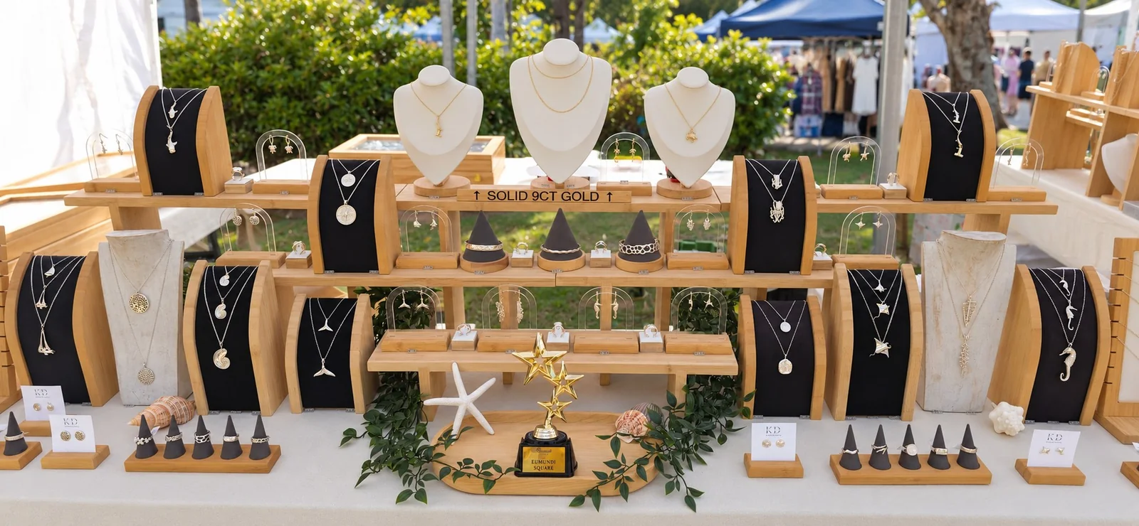 Kaikoa jewellery displayed on timber stands at the Eumundi markets