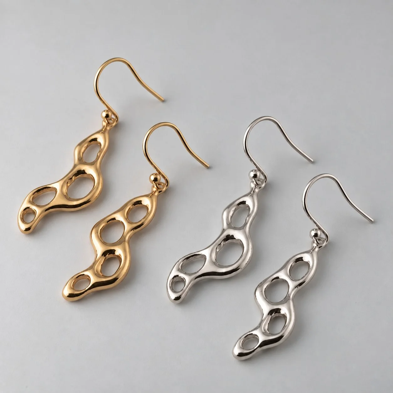 Tidal Swell earrings in solid gold and sterling silver