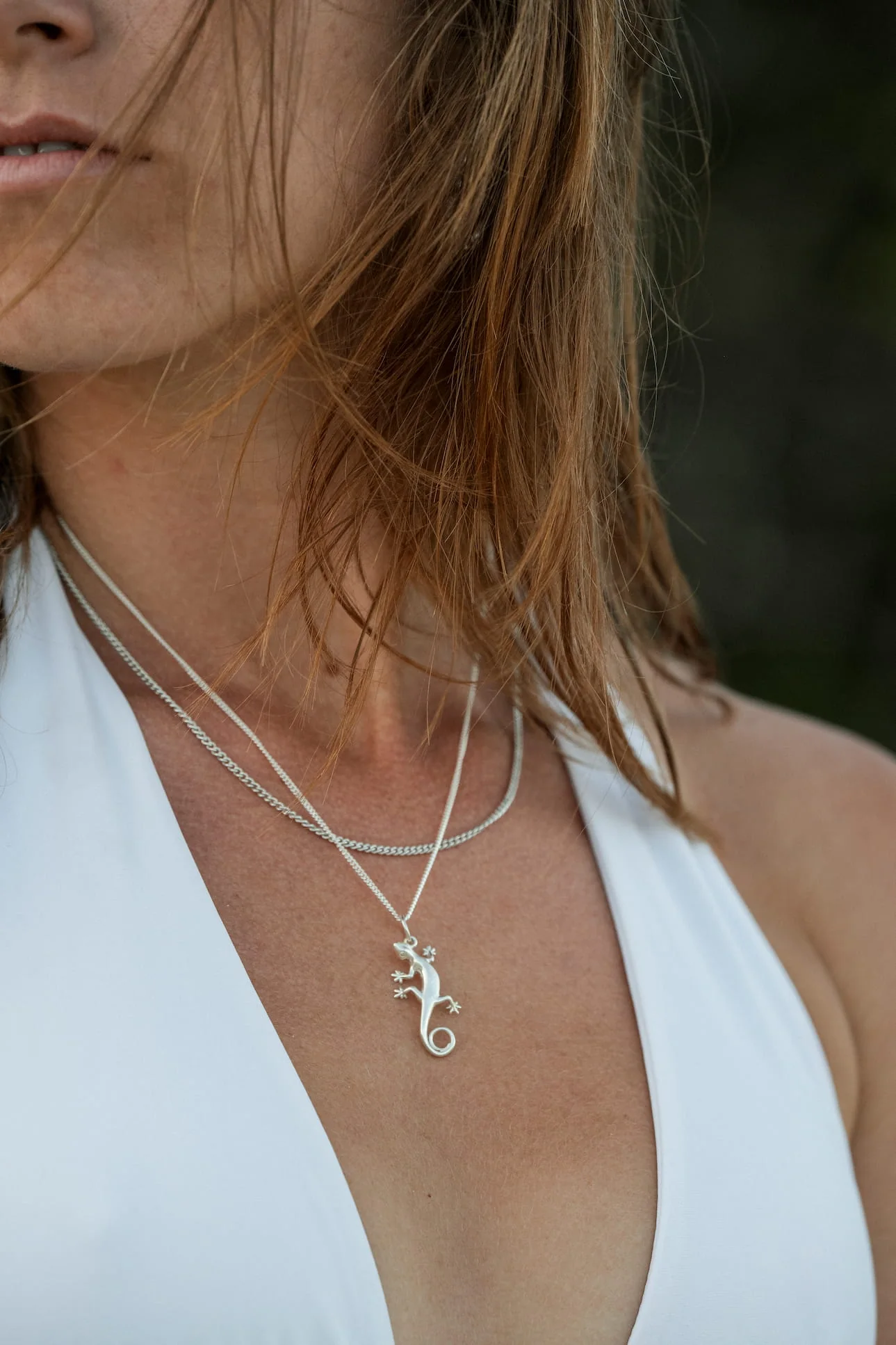 Custom gecko pendant worn on a chain
